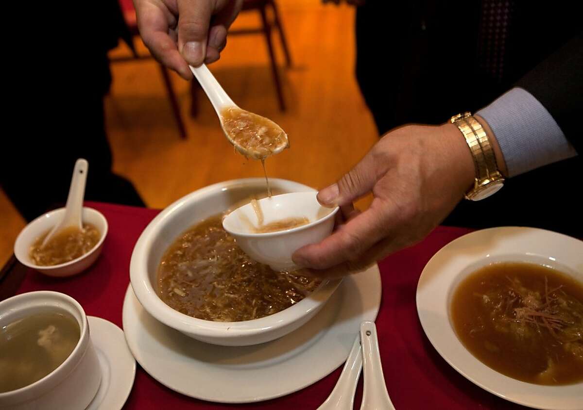 A restaurant employee dishes up shark fin soup at the conclusion of a press conference at the Far East Cafe regarding a bill introduced by legislators to ban the possession, sale and distribution of shark fins used in a traditional Chinese soup on February 14, 2011 in San Francisco.