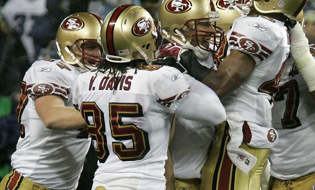 San Francisco 49ers' Vernon Davis and other players mob 49ers quarterback Alex Smith, third from left, after a 49ers touchdown in the fourth quarter Thursday, Dec. 14, 2006, at Qwest Field in Seattle. San Francisco beat the Seahawks, 24-14. (AP Photo/Ted S. Warren) Ran on: 09-07-2011 Tight end Vernon Davis and other 49ers teammates mobbed quarterback Alex Smith after one of the teams three fourth-quarter touchdowns in a 24-14 victory at Seattle five years ago. Briefly, he looked like a worthy heir to Joe Montana and Steve Young.
