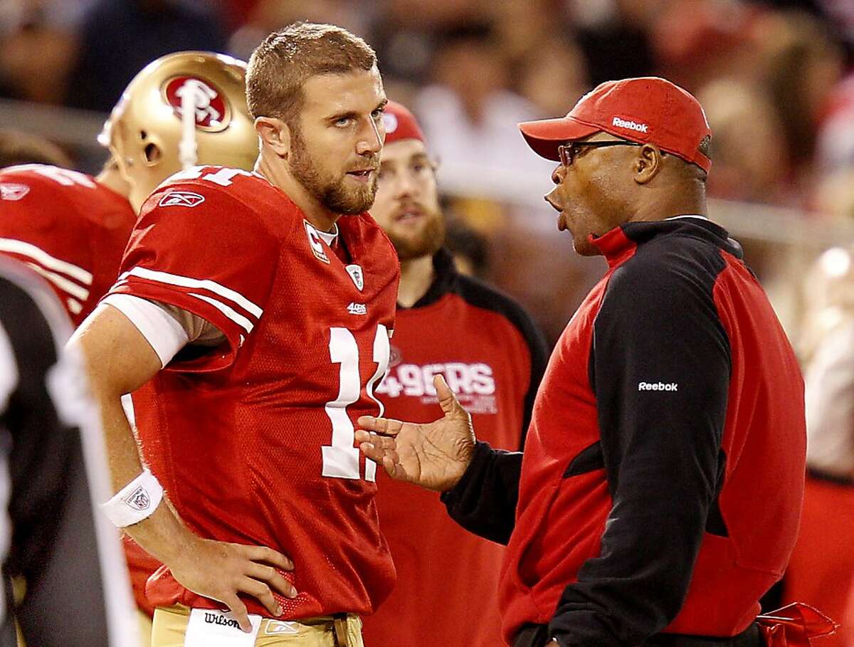 San Francisco 49ers quarterback Alex Smith and head coach Mike Singletary have a discussion on the sidelines, during the Philadelphia Eagles game, after Smith's fumble led to an Eagle score.