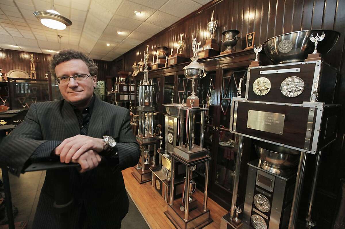 In this Aug. 9, 2011 photo, Dr. Robert Goldman, one of the co-founders of the American Academy of Anti-Aging Medicine, is photographed in his trophy room in Chicago with hardware from 20 Guinness World Records for strength and endurance. "People should be healthy and strong well into 100 to 120 years of age," Goldman says in a biographical video. "That's what's really exciting - to live in a time period when the impossible is truly possible." (AP Photo/M. Spencer Green)