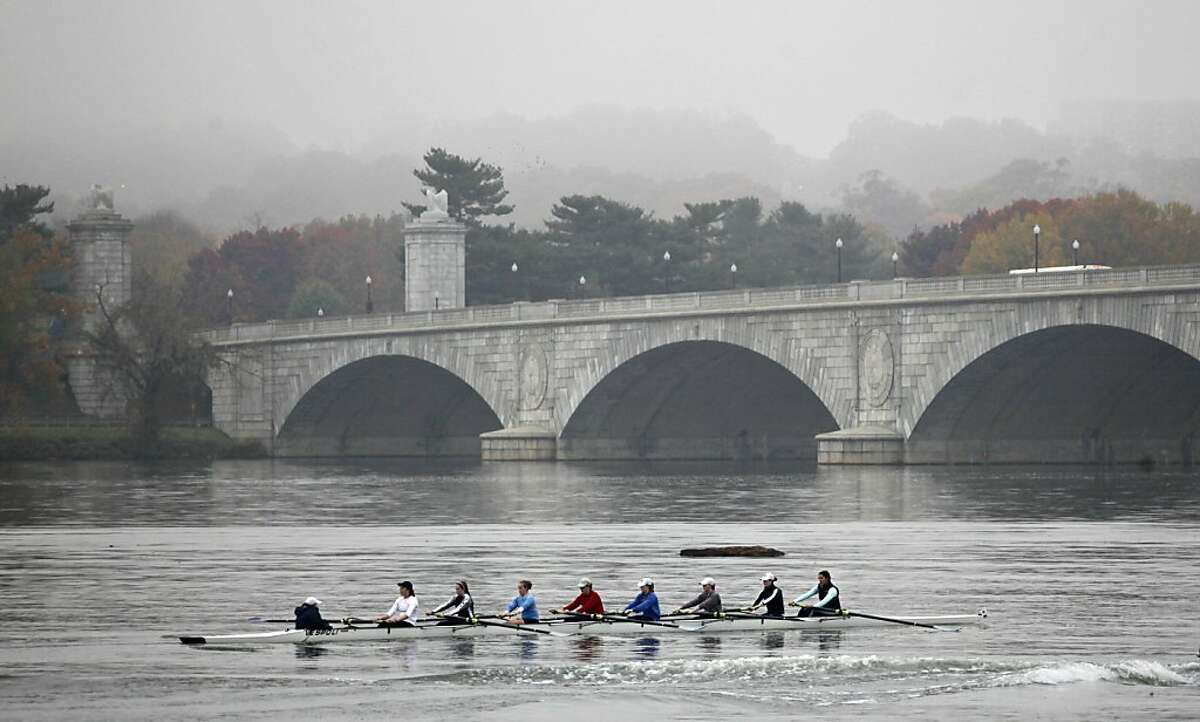Rowers on the foggy Potomac River approach the Memorial Bridge in Washington, Thursday, Nov. 10, 2011. (AP Photo/J. Scott Applewhite)