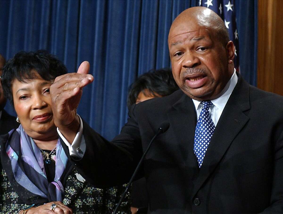 Newly elected Chairman of the Congressional Black Caucus Rep. Elijah Cummings, D-Md., talks to reporters on Capitol Hill Tuesday, Dec. 10, 2002. At left, Rep. Eddie Bernice Johnson, D-Tex., the outgoing chairperson. Members of the House Congressional Black Caucus said Senate Republican leader Trent Lott's apology for implying the country would have been better off had Strom Thurmond won the presidency when he ran in 1948 on a segregationist ticket was insufficient. The comment was made at a 100th birthday party for Thurmond. (AP Photo/Dennis Cook) Ran on: 09-01-2011 Rep. Elijah Cummings says the House oversight committee should examine why CEO compensation is skyrocketing.