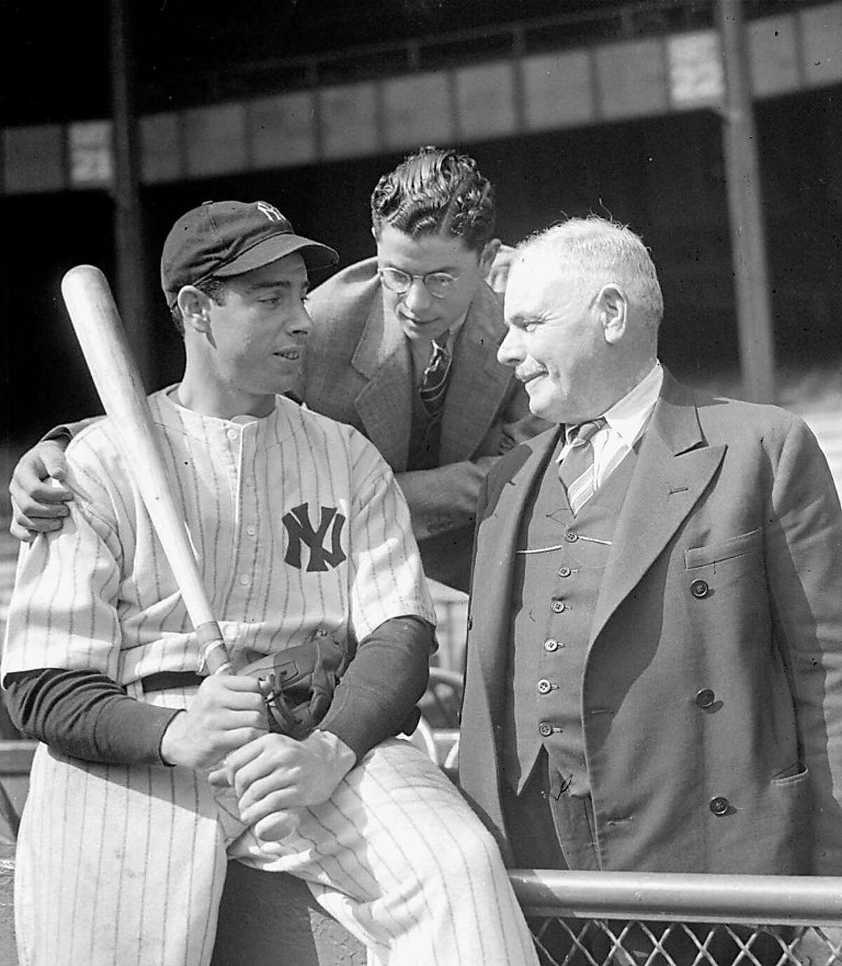 FILE--Joe DiMaggio, New York Yankees center fielder and 1937 home run hitting champ of major league baseball, has the moral support of his brother, Dominic DiMaggio, center, and his father, Joe DiMaggio, Sr., right, for the World Series battle with the New York Giants opening in this Oct. 1937. DiMaggio, the elegant Yankee Clipper whose 56-game hitting streak endures as one of the most remarkable records in baseball or any sport, died Monday, March 8, 1999 at his home in Hollywood, Fla. He was 84.(APPhoto/File ) Ran on: 08-28-2011 In 1936, Dominic DiMaggio (right) decided to try following big brother Joe into pro baseball.