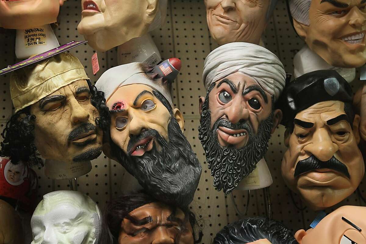 CHICAGO, IL - OCTOBER 28: Halloween masks of Muammar Gaddafi, Osama bin Laden, and Saddam Hussein are offered for sale at Fantasy Costumes on October 28, 2011 in Chicago, Illinois. The store, which had long lines at the registers at 4 AM this morning, is open around the clock through Halloween to help keep up with customer demand. Retailers nationwide are expecting record sales for Halloween merchandise this year with shoppers spending close to $7 billion dollars to celebrate the holiday. (Photo by Scott Olson/Getty Images)