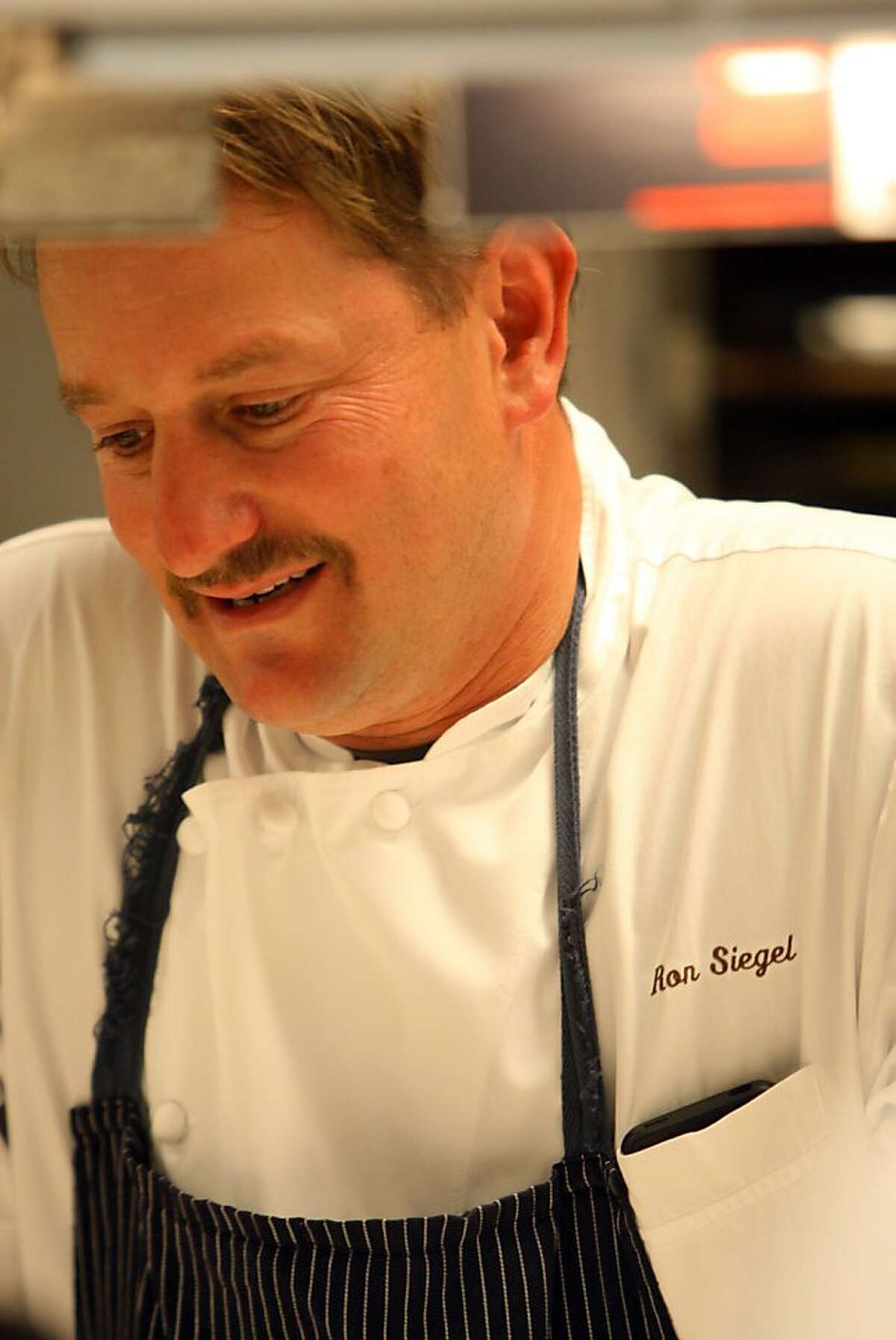 Ron Siegel inspects his dish before it's served at Michael Mina restaurant in San Francisco, Calif., on Sunday, Oct. 9, 2011. Some of the top chefs in the Bay Area gathered to raise money for Ronnie Lott's All Stars for Kids charity.