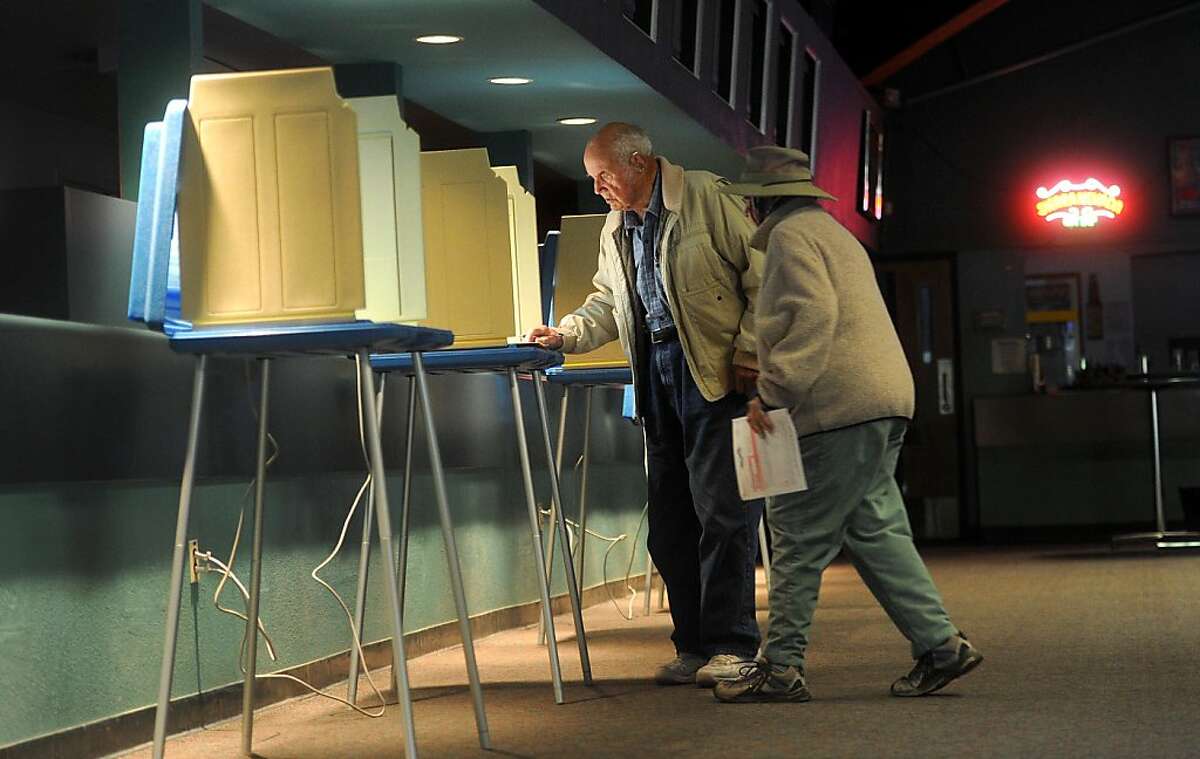At a horse betting facility converted to a polling location of election day, Richard and Shirley Ibey cast their ballots in Vallejo, Calif., on Tuesday, Nov. 8, 2011.