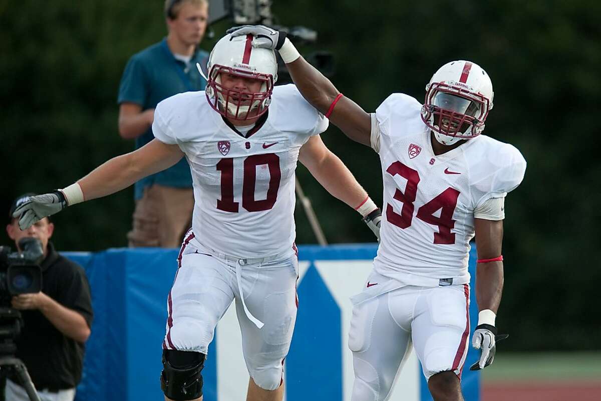 Geoff Meinken (10) and Jeremy Stewart (34) celebrate a play in Stanford's 44-14 win over Duke in Durham, N.C. on September 10, 2011. STANFORD, CA - SEPTEMBER 10: Stanford defeats Duke 44-14 at Wallace Wade Stadium on the Duke University Campus, Saturday, September 10, 2011 in Durham, North Carolina.