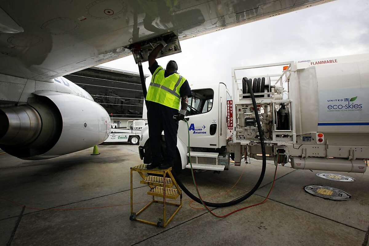 Monte Hawkins, lead aircraft refueler, fills the taxi'd aircraft with biofuel, prior to the first US commercial flight powered by advanced biofuel, Monday, November 7, 2011 at George Bush Intercontinental Airport in Houston, Texas. The Boeing 737 departed terminal E at 10:30am and was bound for Chicago O'Hare International Airport. (Todd Spoth / For The Chronicle)