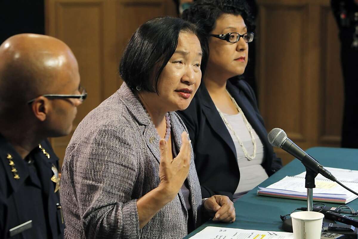 Oakland Mayor Jean Quan, center, answers a question during a press conference at City Hall in Oakland, Calif, on Wednesday, October 26, 2011. Quan, interim Police Chief Howard Jordan, left, and City Administrator Deanna Santana, off camera, anwered questions, Wednesday, after police used tear gas and non-lethal weapons against demonstrators from the Occupy Oakland group the previous night.