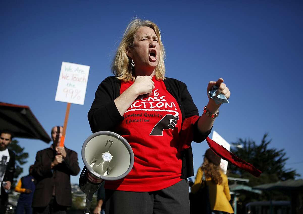 San Francisco State University faculty member Catherine Powell leads chants during a protest against cuts to public education at San Francisco State University on Tuesday, November 11, 2011 in San Francisco, Calif.