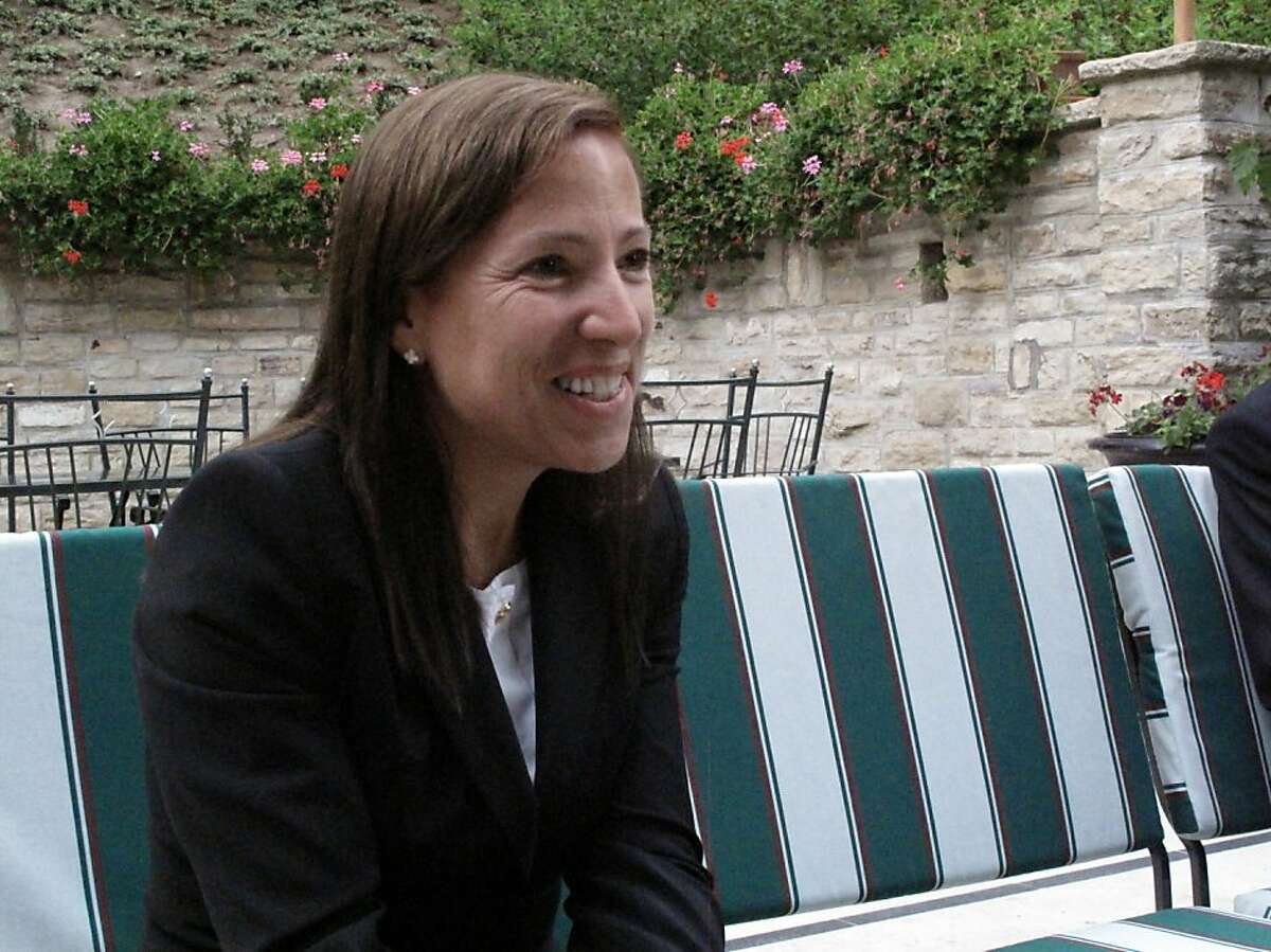 U.S. Ambassador to Hungary Eleni Tsakopoulous Kounalakis talks with American visitors in the garden of her Budapest home.