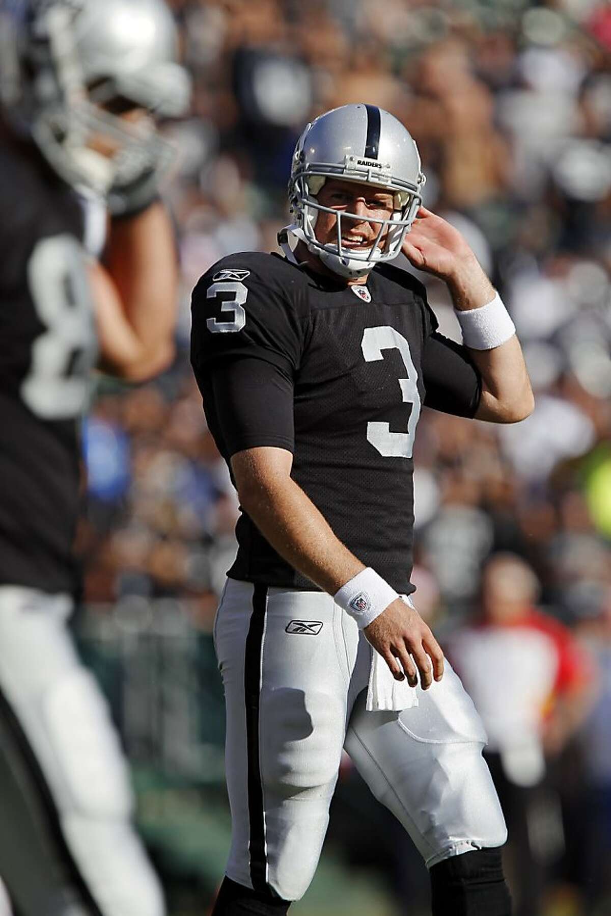 OAKLAND, CA - OCTOBER 23: Quarterback Carson Palmer #3 of the Oakland Raiders reacts as he heads to the sidelines after throwing another interception in the fourth quarter against the Kansas City Chiefs on October 23, 2011 at O.co Coliseum in Oakland, California. The Chiefs won 28-0. (Photo by Brian Bahr/Getty Images)