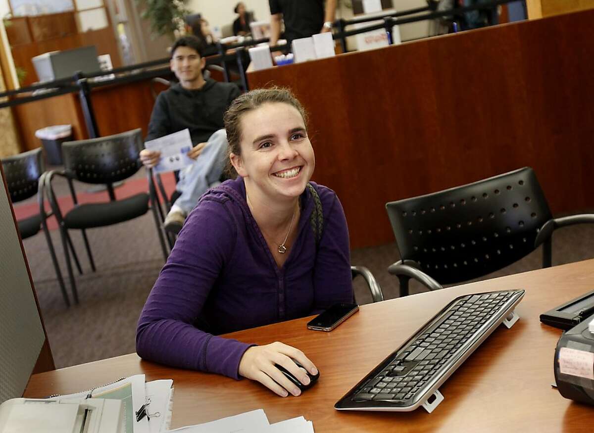 Sasha Hood smiles about closing her Wells Fargo accounts and moving her monies to Cooperative Center Credit Union. Credit Unions like the Cooperative Center Federal Credit Union in Berkeley, Calif. are seeing more new customers transferring accounts from the more traditional big banks.