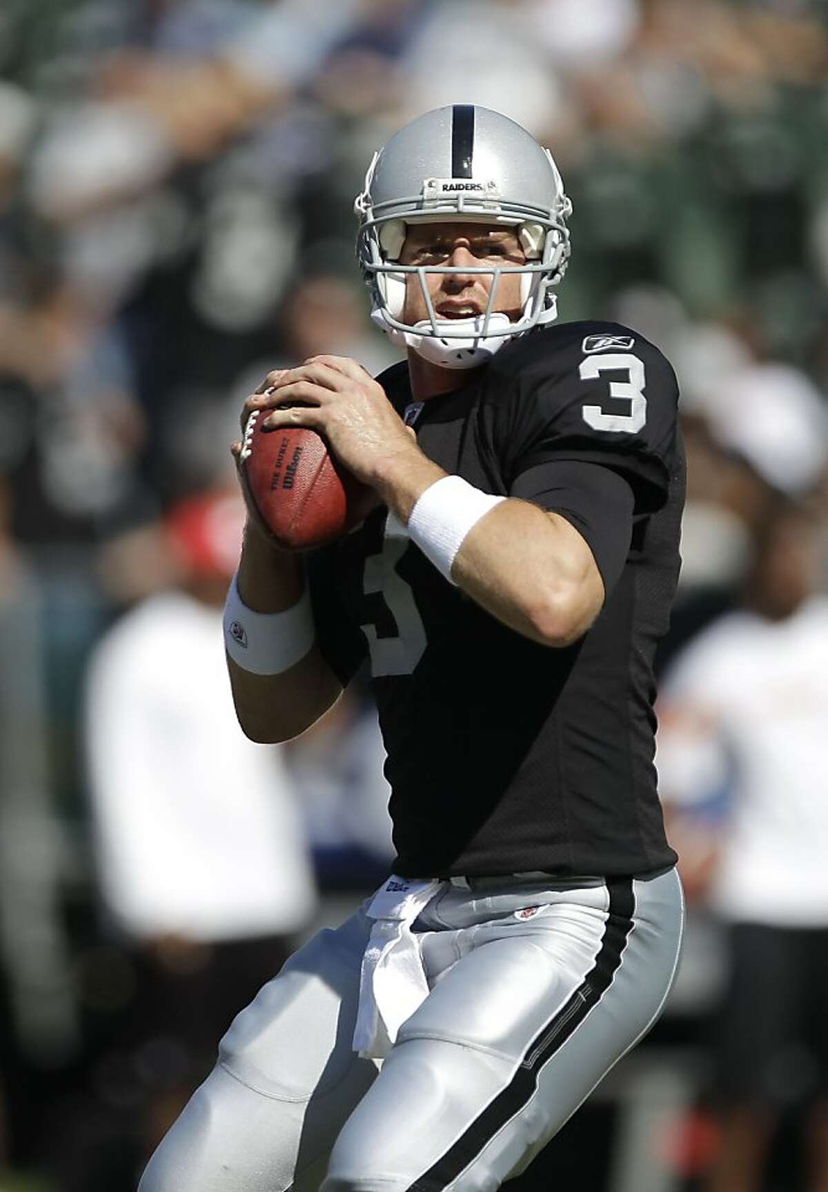 Oakland Raiders quarterback Carson Palmer (3) warms up before an NFL football game against the Kansas City Chiefs in Oakland, Calif., Sunday, Oct. 23, 2011. (AP Photo/Paul Sakuma) Ran on: 11-06-2011 Carson Palmer should have a much better grasp of the Raiders offense in his second game after a bye week break. Ran on: 11-06-2011 Carson Palmer should have a much better grasp of the Raiders offense in his second game after a bye week break.