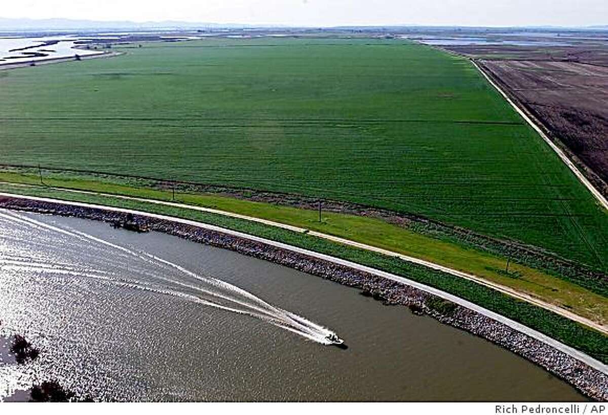 ** FILE ** A boat passes through the Sacramento-San Joaquin River Delta near Isleton, Calif., Feb. 25, 2001. Global warming will dramatically limit the availability of water in the West, including areas like the Sacramento-San Joaquin River Delta, according to a new study that Scripps Institute scientists bill as the rosiest of a series of recent climate forecasts for the already parched region. (AP Photo/Rich Pedroncelli, File)