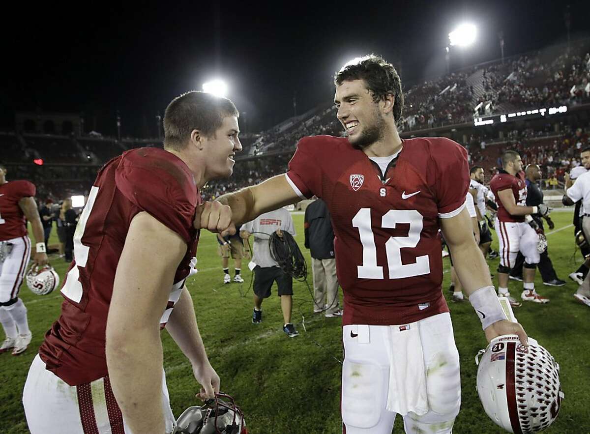 Stanford quarterback Andrew Luck (12) celebrates with Stanford linebacker Chase Thomas (44) after an NCAA college football game against Washington Saturday, Oct. 22, 2011, in Stanford, Calif. Stanford defeated Washington 65-21. (AP Photo/Paul Sakuma) Ran on: 10-27-2011 Stanford quarterback Andrew Luck (12) is easily atop the Scripps Heisman Poll, which has picked the Heisman Trophy winner correctly 20 times in 24 years.