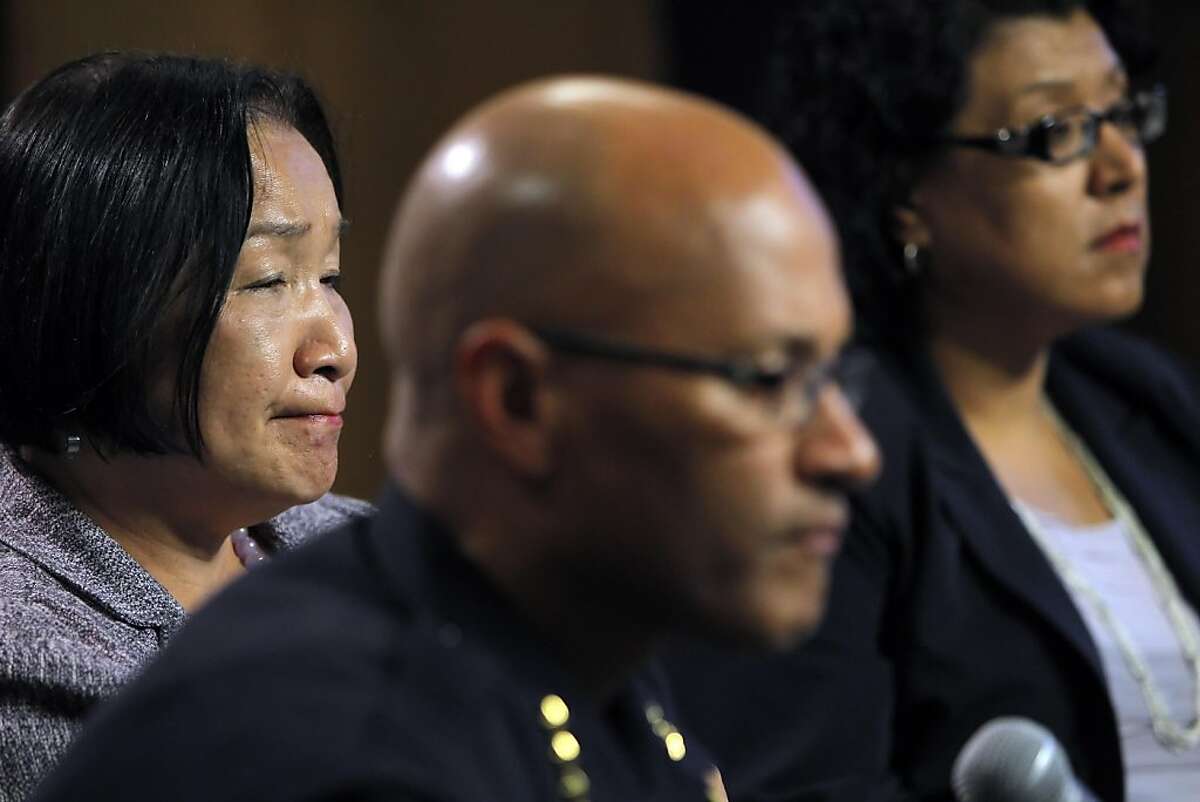 Oakland Mayor Jean Quan, left, listens to a question during a press conference at City Hall in Oakland, Calif, on Wednesday, October 26, 2011. Quan, interim Police Chief Howard Jordan, and City Administrator Deanna Santana anwered questions, Tuesday, after police used tear gas and non-lethal weapons against demonstrators from the Occupy Oakland group the previous night.