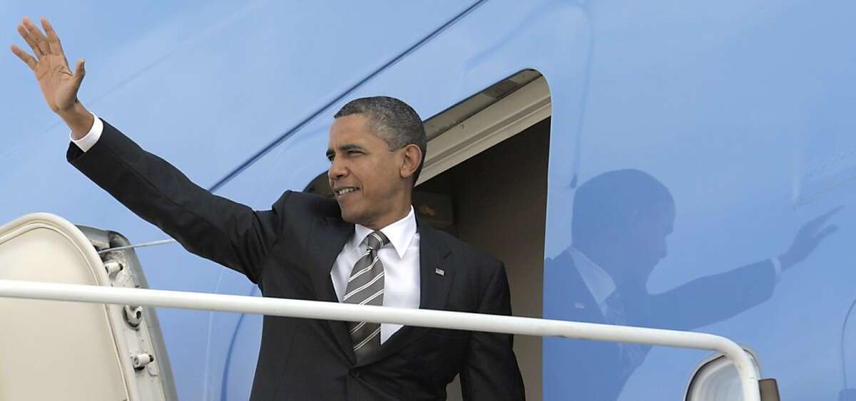 President Barack Obama waves before boarding Air Force One at Andrews Air Force Base in Md., Monday, Oct. 24, 2011. Obama is heading on a three-day trip to the West Coast. (AP Photo/Susan Walsh) Ran on: 10-25-2011 President Obama boards Air Force One for his western fundraising trip.