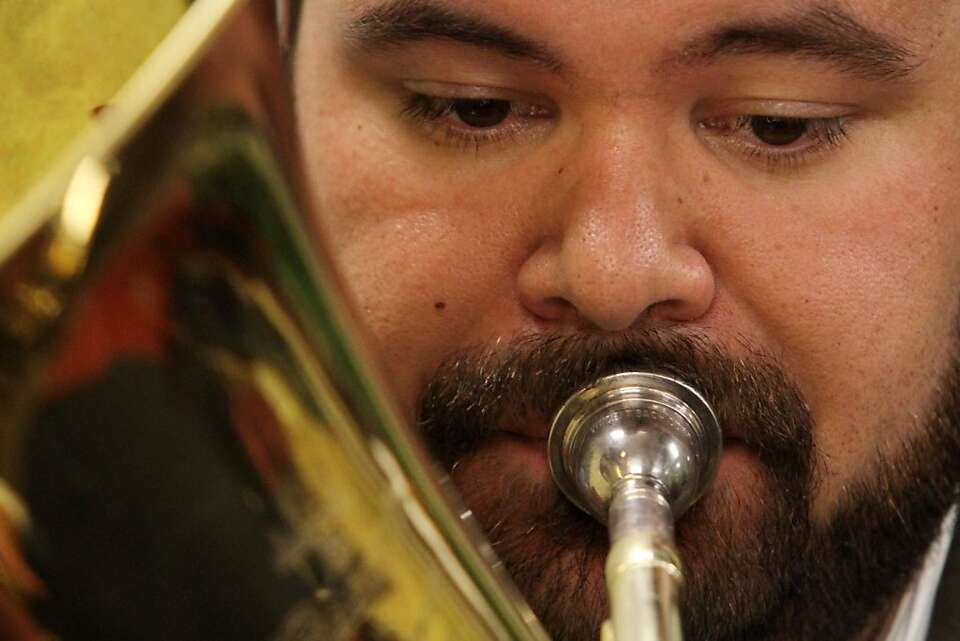 Adrian Quince strikes up the band even 3 of them