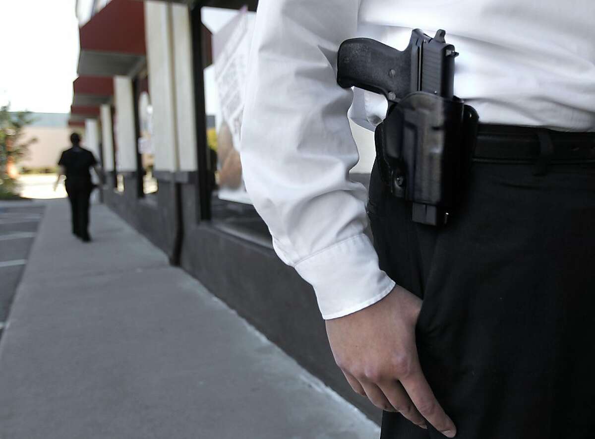 The press secretary of the gun rights group Responsible Citizens of California, Yih-Chau Chang with his Sig Sauer P226 .40 Smith and Wesson sidearm he openly and legally carries on his belt, in San Leandro, Ca., on Thursday October 20, 2011.