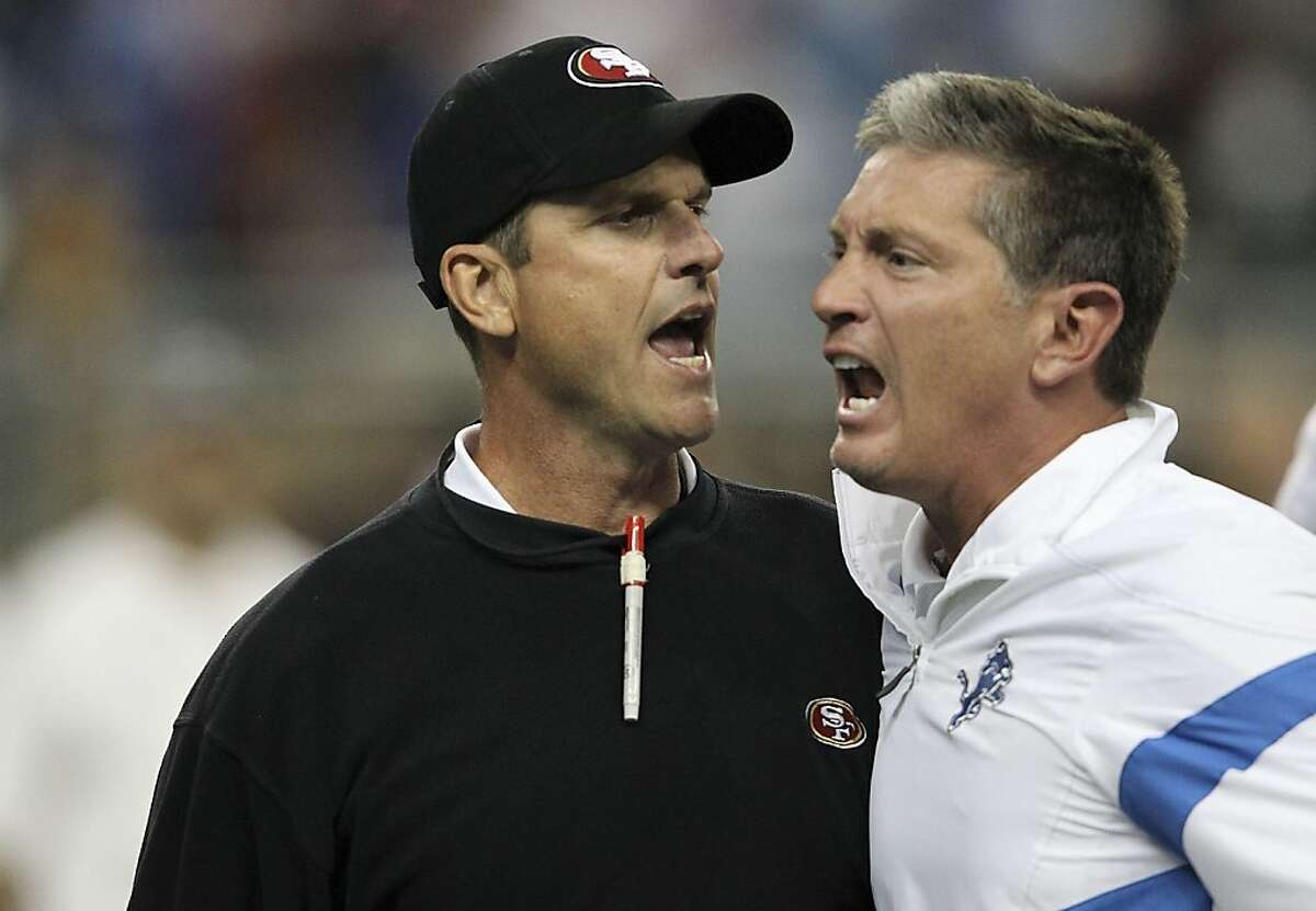 DETROIT - OCTOBER 16: Jim Harbaugh head coach of the San Francisco 49ers argues with Jim Schwartz of the Detroit Lions during the NFL game at Ford Field on October 16, 2011 in Detroit, Michigan. The 49ers defeated the Lions 25-19. (Photo by Leon Halip/Getty Images)