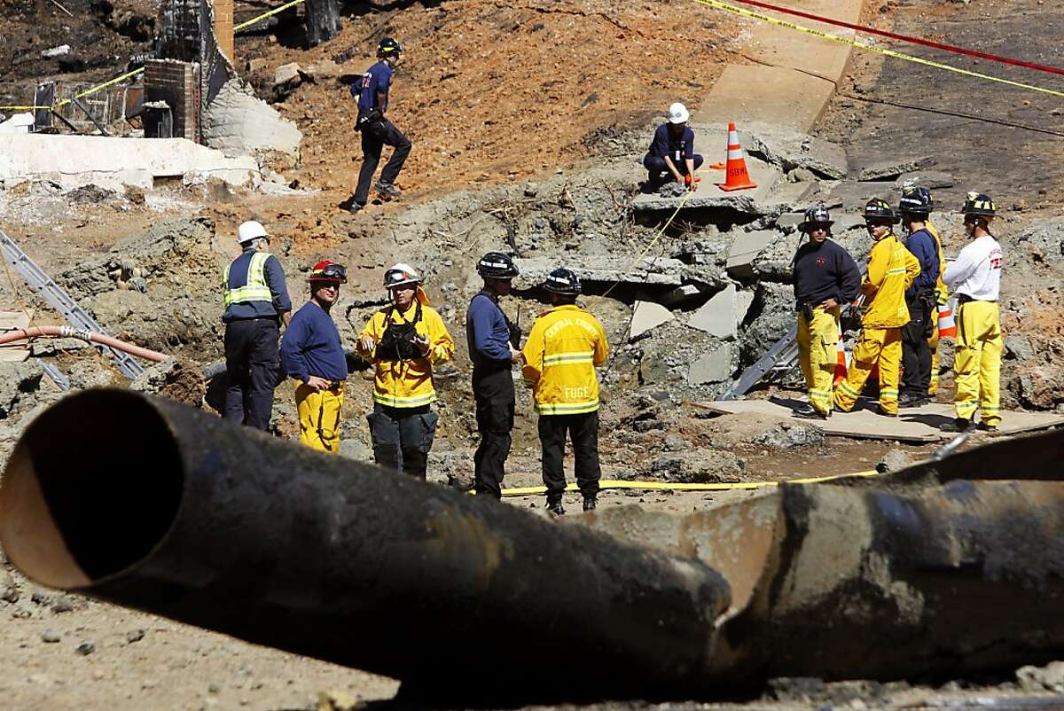 investigators at the scene in San Bruno, Calif. on Saturday, Sept. 11, 2010 where a natural gas line explosion destroyed more than 35 homes and killed four. Two others remain missing.