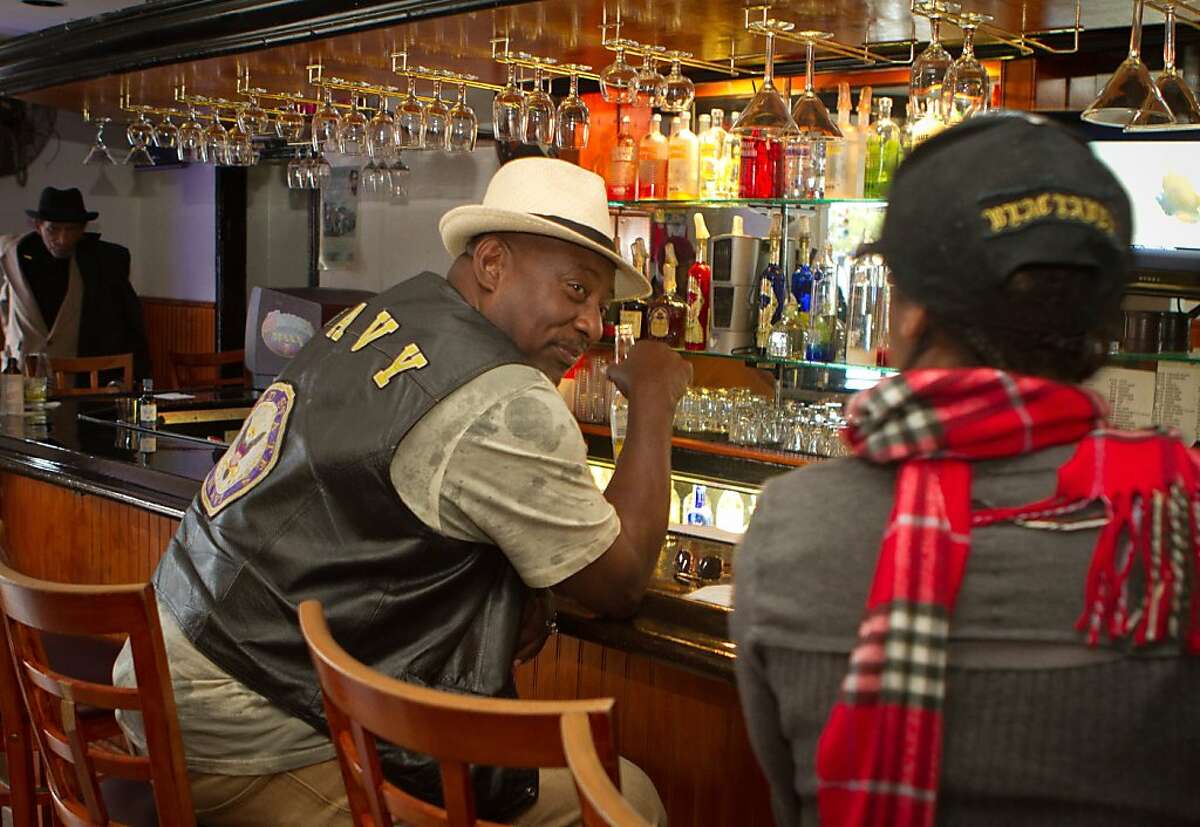 Robert Kemp has a word with a friend while having a beer at Sam Jordan's Bar in San Francisco, Calif., on Tuesday, October 18, 2011.