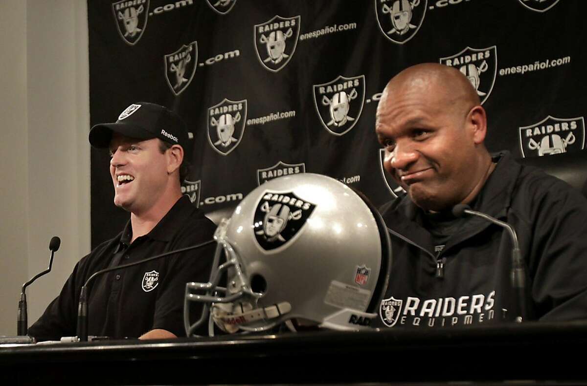 New quarterback Carson Palmer (left) and head coach Hue Jackson ended the press conference on a light note. Oakland Raiders head coach Hue Jackson introduced his new quarterback Carson Palmer at a press conference at the club headquarters in Alameda, Calif. Tuesday October 18, 2011.