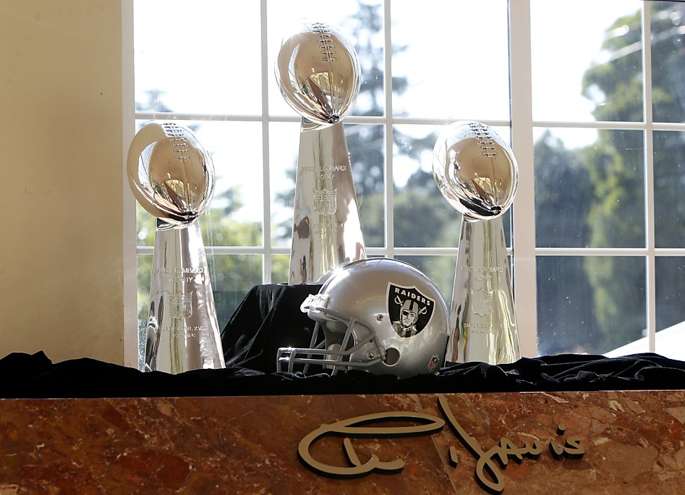 Oakland Raiders fans pay tribute to the late Al Davis, the Raiders' owner  who died 10/8, at the Coliseum before a game against the Cleveland Browns  on October 16, 2011 in Oakland