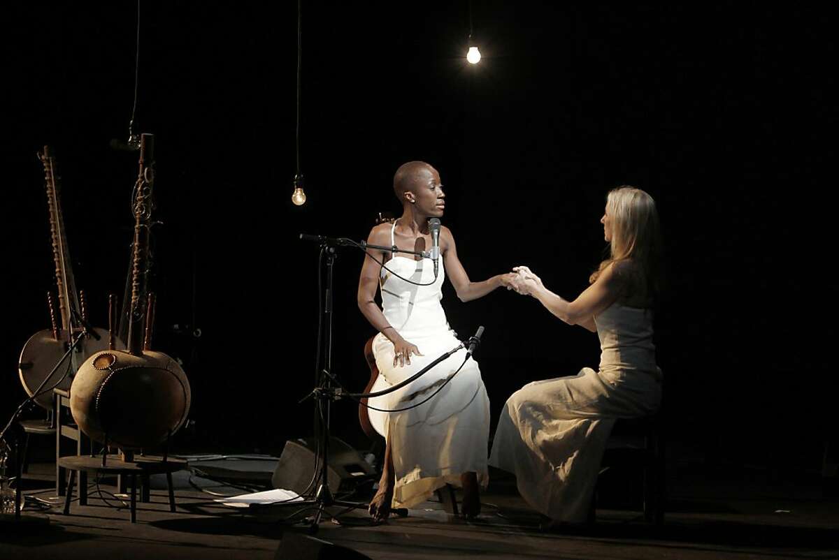 This Tuesday Oct.11, 2011 photo provided Friday Oct.14, 2011 by the Theatre des Amandiers, singer Rokia Traore, of Mali, left, performs with USA's Tina Benko in Desdemona, directed by American director Peter Sellars, at the Amandier theater in Nanterre, outside Paris. With "Desdemona," a play that opened earlier this week, the Nobel laureate Toni Morisson probes the hidden suffering and occult oppression woven into Shakespeare's tale Othello. (AP Photo/Pascal Victor/ArtComArt) NO SALES - EDITORIAL USE ONLY