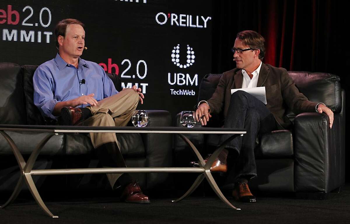 John Donahoe (left), of eBay, speaks with John Battelle, of Federated Media Publishing Inc., at the Web 2.0 Summit at the Palace Hotel on Monday, October 17, 2011 in San Francisco, Calif.