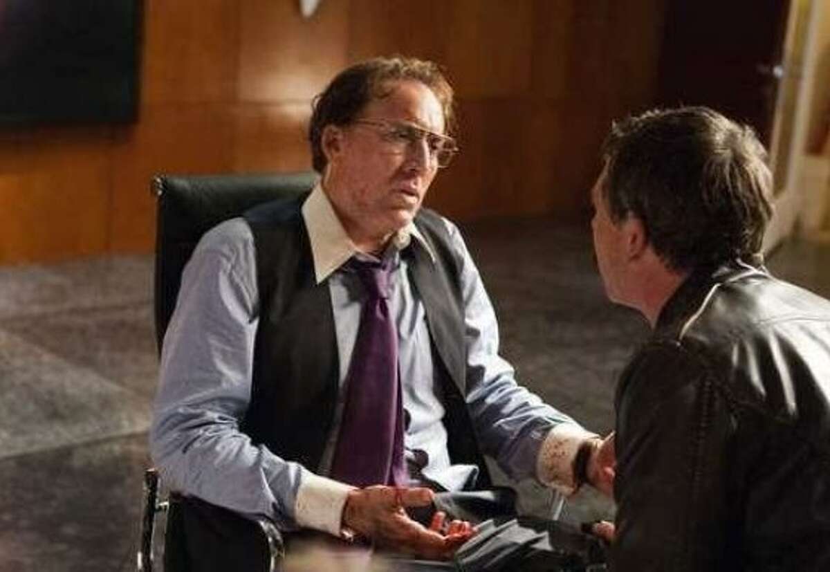 Nicolas Cage in "Trespass." Other actor is unidentified.