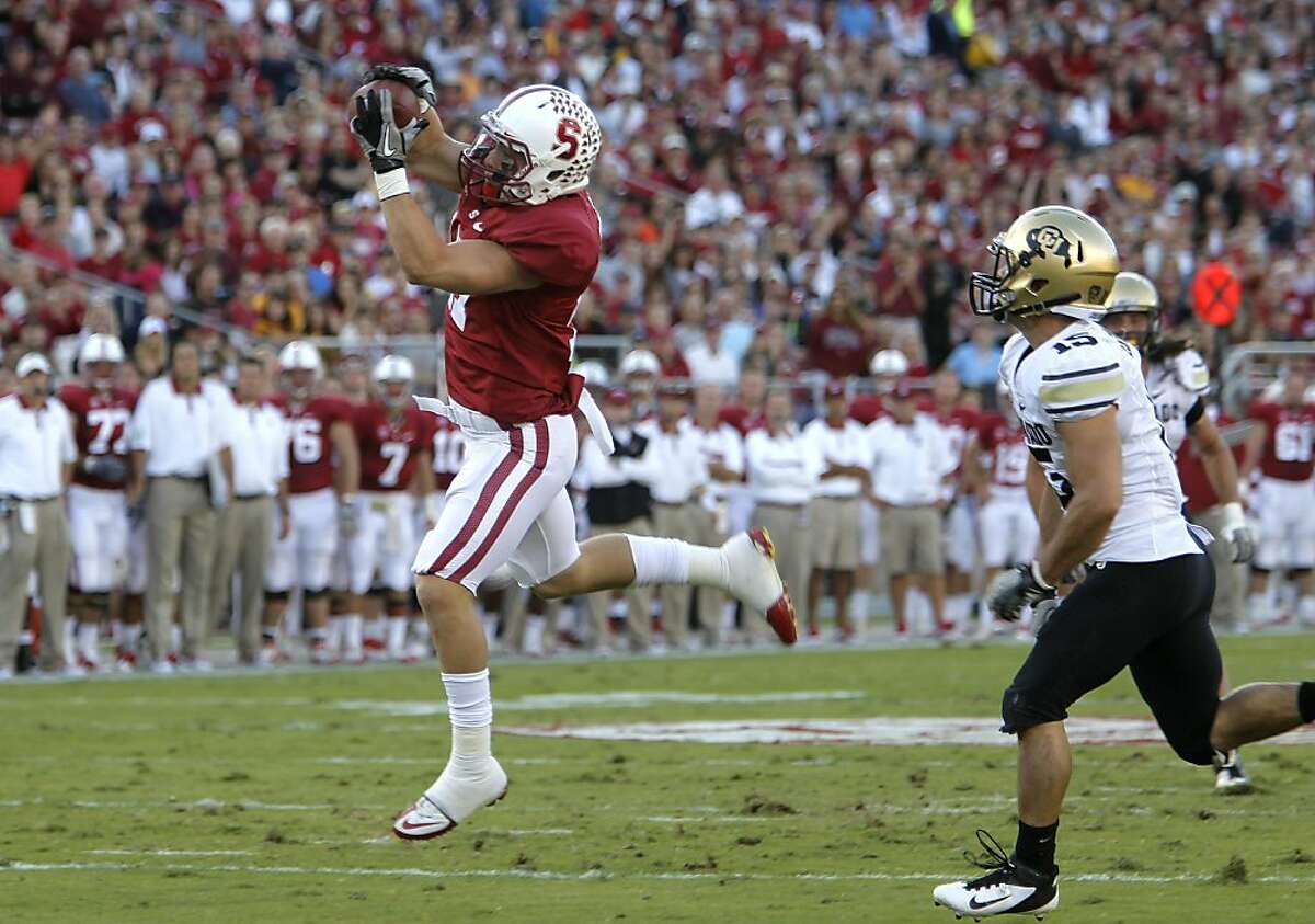 Stanford's Coby Fleener (82) takes a pass down to the 1 yard line to set up a second quarter touchdown, Colorado's Jason Espnoza on the coverage, as the Stanford Cardinal takes on the Colorado Bulldogs at Stanford Stadium on Saturday October 8, 2011, in Palo Alto, Ca. Ran on: 10-13-2011 Tight end Coby Fleener has 255 yards receiving and five touchdowns this season.