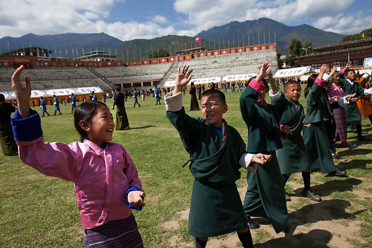 THIMPHU, BHUTAN - OCT 12 : Bhutanese students practices a dance for the upcoming Royal wedding celebrations at a stadium October 12, 2011, in Thimphu, Bhutan. His majesty King Jigme Khesar Namgyel Wangchuck, 31, will wed Jetsun Pema, 21, on October 13 in the historical Punakha Dzong, the same venue that hosted the King's historical coronation ceremony in 2008. The Oxford-educated king is popular in the country and the ceremony will be followed by celebrations in the capital and nationwide. (Photo by Paula Bronstein /Getty Images)
