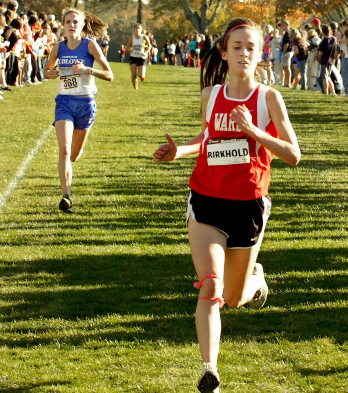 Carly Birkhold, of Warde, fourth in the girls varsity cross country championship race at Waveny Park in New Canaan, on Thursday, Oct.22,2009.
