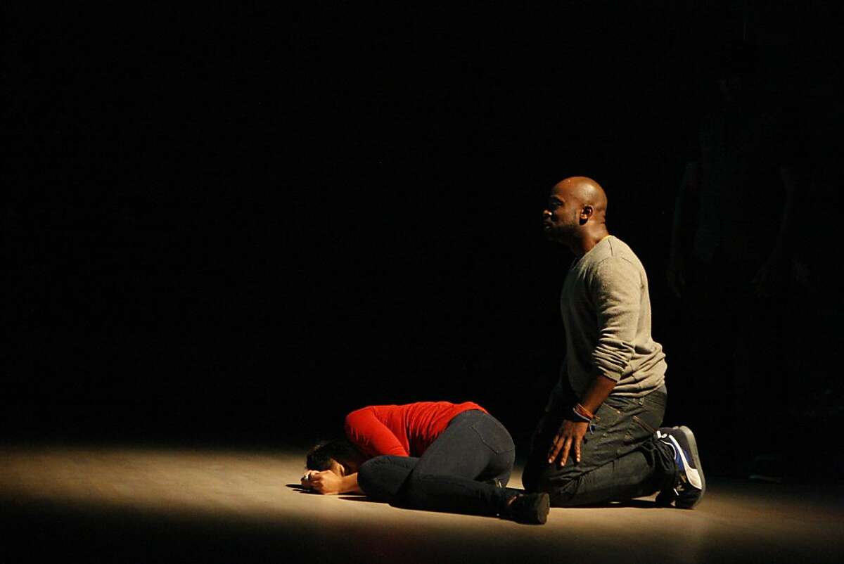 Marc Bamuthi Joseph (right) with Traci Tolmaire during a rehearsal for his multimedia performance piece, "Red, Black & Green", at the Yerba Buena Center for the Arts in San Francisco, Calif., on Thursday, Oct. 13, 2011.