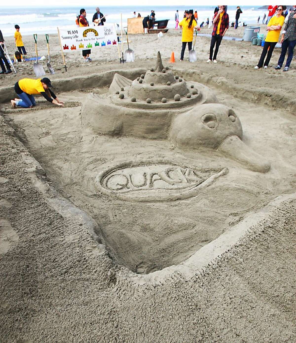 Children, architects build sand castles, dreams