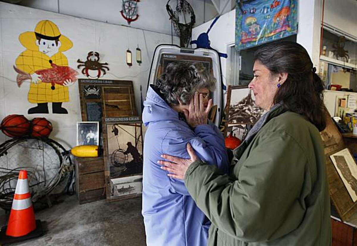 Angela Cincotta (right) comforts her mother Stephanie, matriarch of the family-owned Alioto-Lazio Fish Company, after they announced plans to shut down operations indefinitely in San Francisco, Calif., on Thursday, Jan. 13, 2011, until an extensive oil clean-up project by the Port and Exxon is completed directly behind their building.