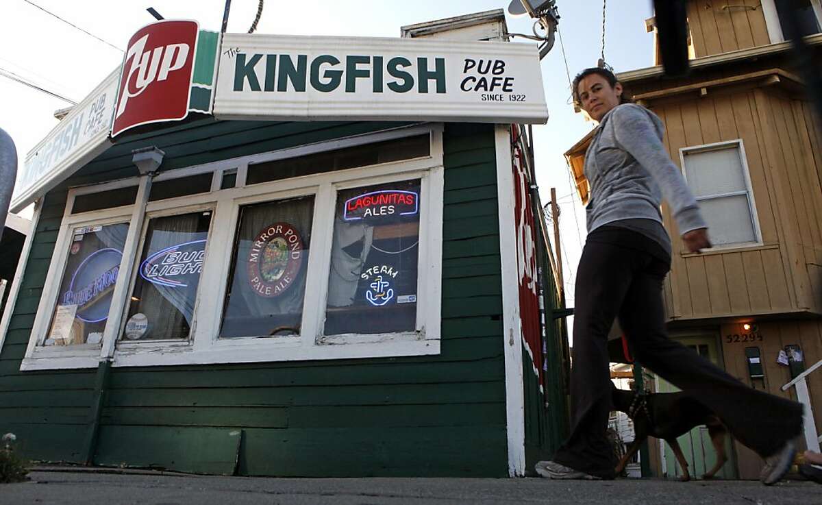 Pedestrians have been walking past the Kingfish for decades. Emil Peinert owner of the Kingfish pub and Cafe has filed to make his very beloved watering hole a Oakland landmark Thursday October 6, 2011.