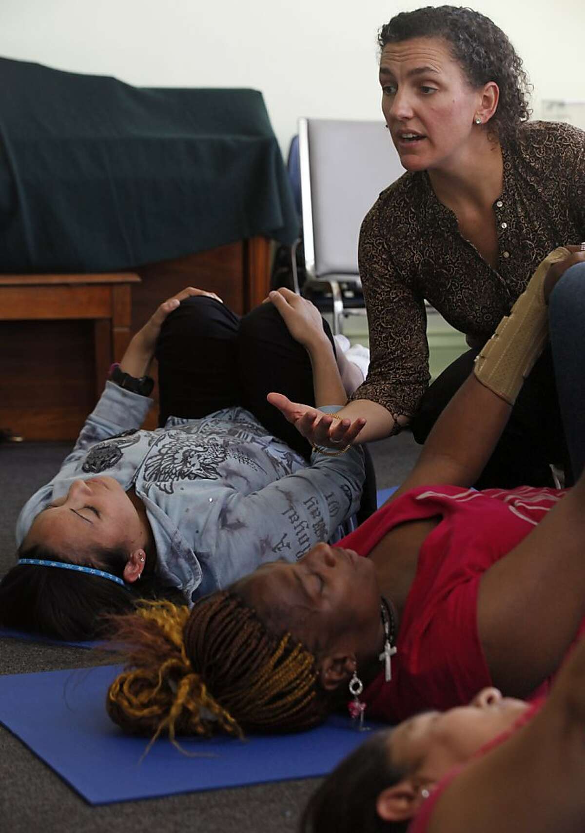 Kate Holcombe, founder of the Healing Yoga Foundation leads a class for Compass Family Services with a group of homeless mothers Wednesday September 21, 2011 in San Francisco.
