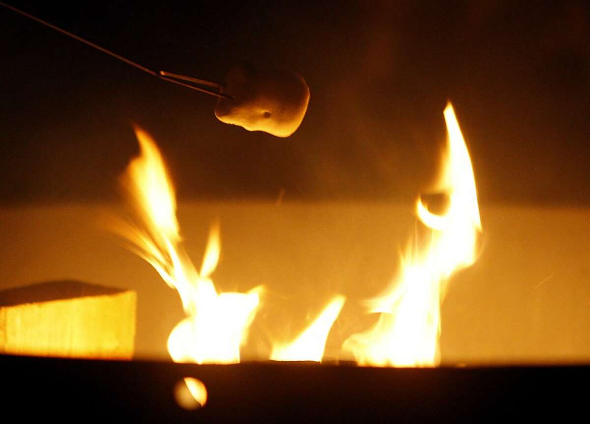 Square 1: Boy Scouts roast marshmallows over a fire in the Presidio.