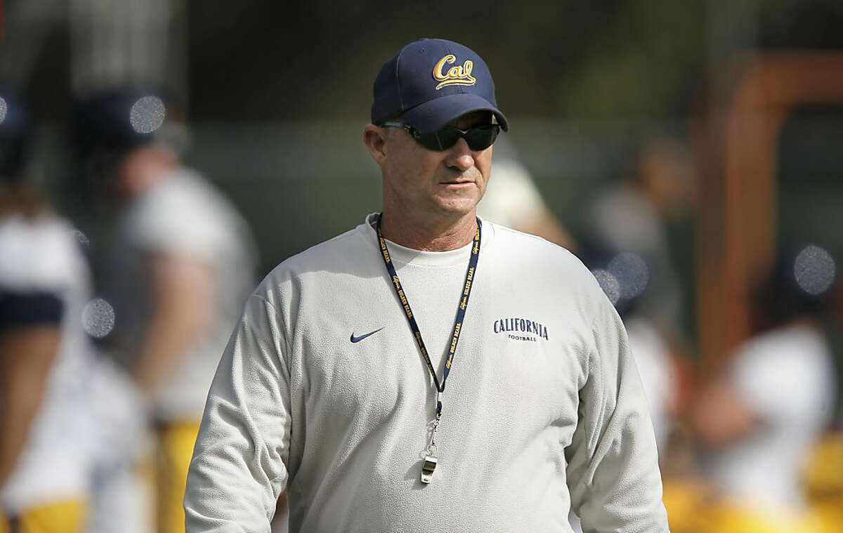 Head coach Jeff Tedford keeps a close watch during practice, as the UC California Bears open their fall training camp in Berkeley, Ca. on Saturday August 6, 2011. Ran on: 08-10-2011 Cal head coach Jeff Tedford observed the action during the first day of training camp Saturday. Several freshmen already have made an impression.