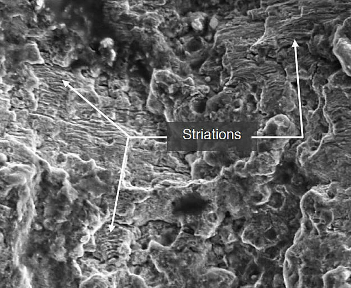 An enhanced image of telltale signs of pressure related stress on the San Bruno line made at 3,700 times magnification with a scanning electron microscope. Note white areas are ridges or striations, each marking steady but minute progress in the growth of a crack through the pipe's weld.