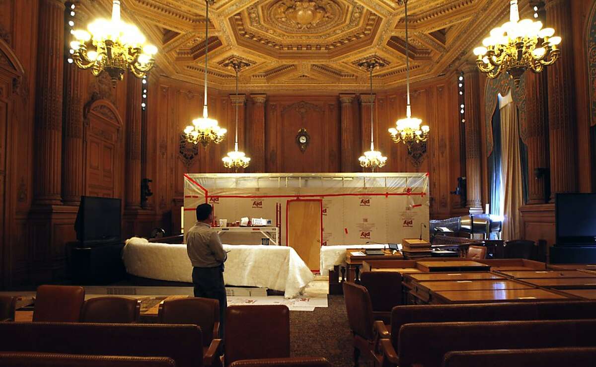 Robert Ritter City Hall's building manager stands in the center of the supervisors chambers. A temporary containment room has been built in the center of the city of San Francisco board of supervisors chambers to mitigate dust as the city builds a new wheel chair ramp costing the tax payers over $699,000 to install.