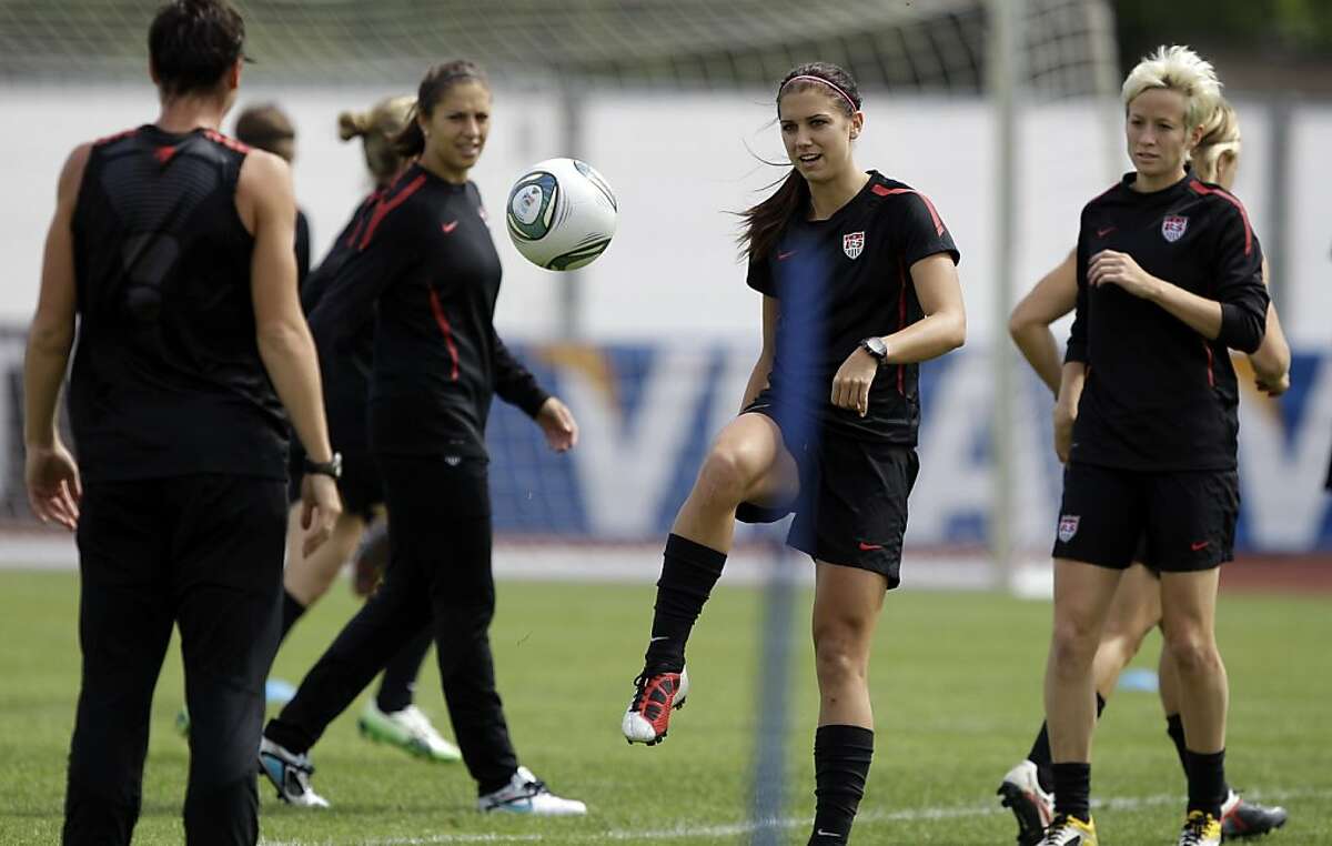 United States', from left, Abby Wambach, Carli Lloyd, Alex Morgan and Megan Rapinoe go through drills during a training session in preparation for the final match against Japan during the WomenÍs Soccer World Cup in Frankfurt, Germany, Friday, July 15, 2011. (AP Photo/Marcio Jose Sanchez) Ran on: 07-17-2011 Alex Morgan (second from right), becoming known for her exuberant celebrations, prepares for todays World Cup final with Abby Wambach (left), Carli Lloyd and Megan Rapinoe.