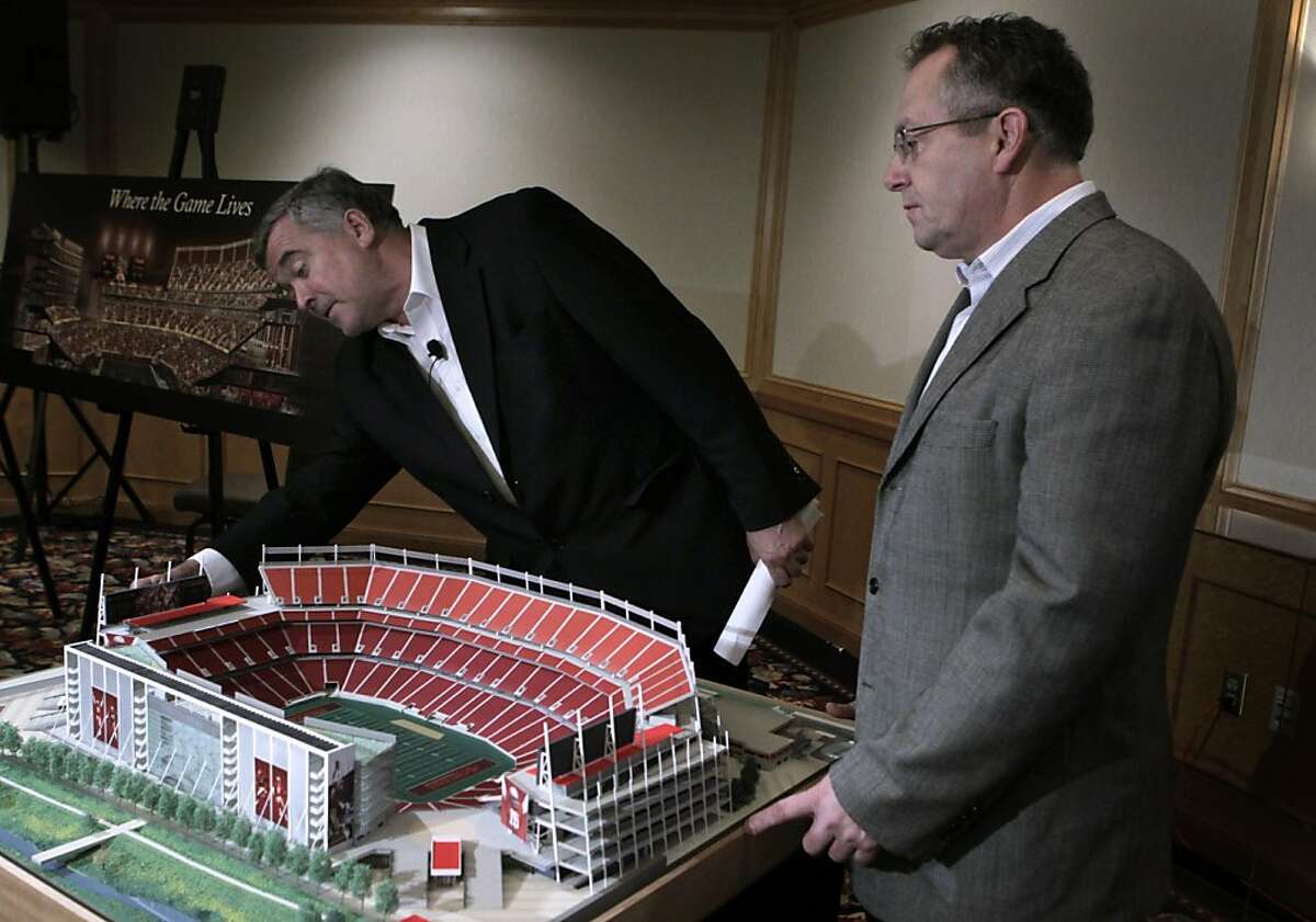 Lead designers Fernando Vazquez (left) and Timothy Cahill view a model of their proposed stadium for the San Francisco 49ers in Santa Clara, Calif. on Wednesday, August 3, 2011.