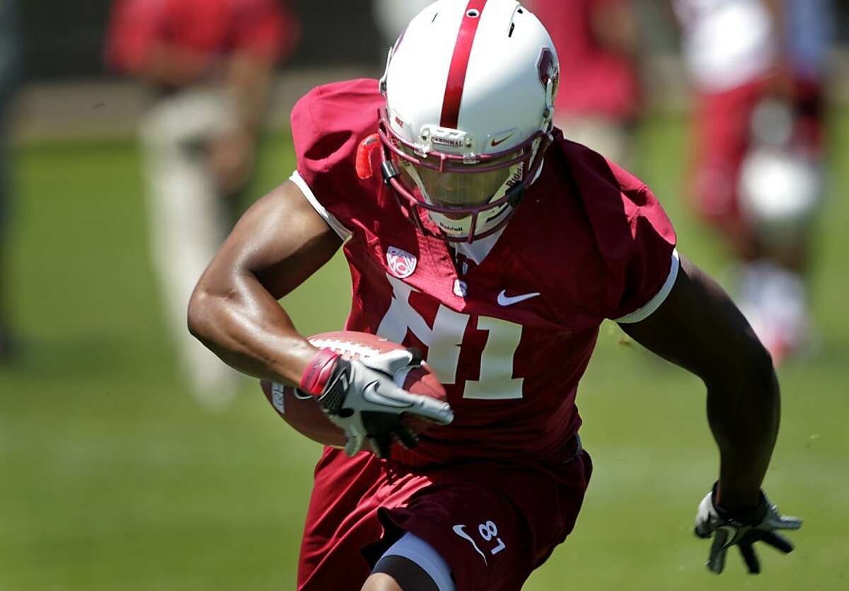 The Stanford's wide receiver Chris Owusu runs with the ball during practice at training camp, Monday August 8, 2011, in Stanford Calif.