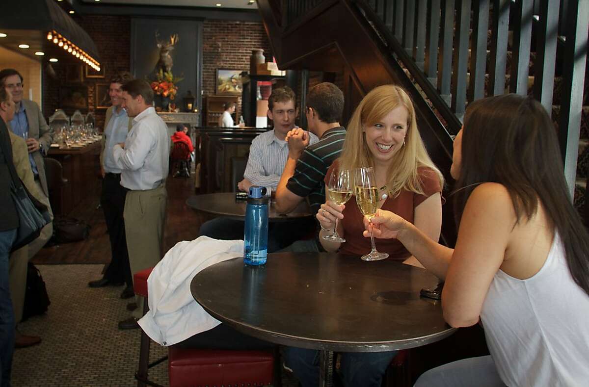 People enjoying happy hour at Wayfare Tavern in San Francisco, Calif., on Friday, July 29th, 2011.