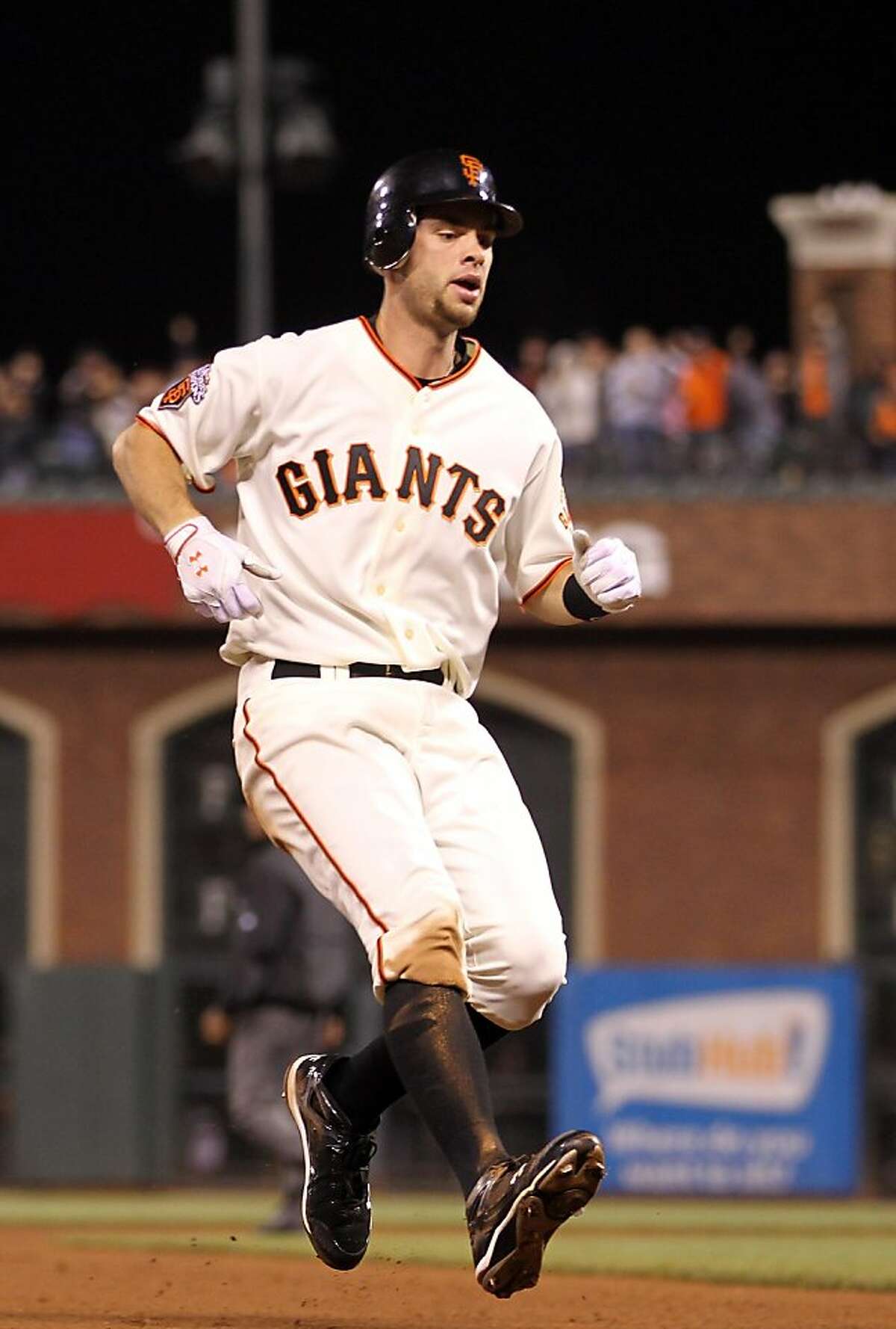 SAN FRANCISCO, CA - AUGUST 24: Brandon Belt #9 of the San Francisco Giants runs to third base for a stand up triple in the fifth inning against the San Diego Padres at AT&T Park on August 24, 2011 in San Francisco, California. (Photo by Ezra Shaw/Getty Images)
