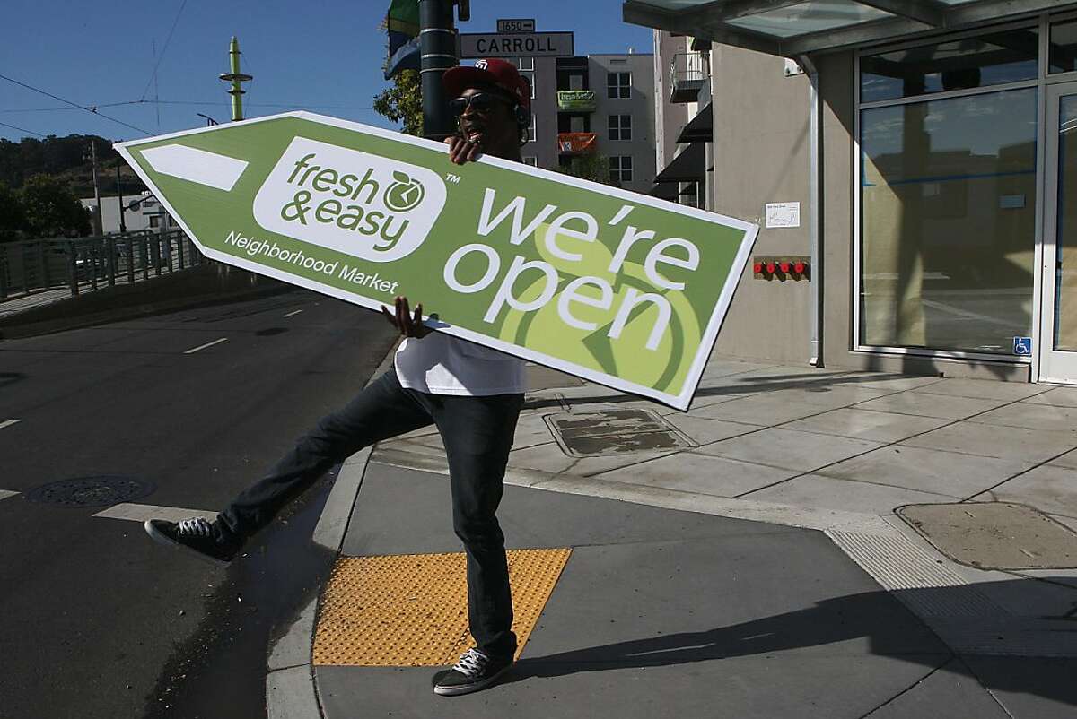 Fresh & Easy Neighborhood Market is the first new grocery store in Bayview-Hunters Point neighborhood to open in over 20 years in San Francisco, Calif., as a sign spinner advertises the market opening on Wednesday, August 24, 2011.